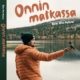 Onnin matkassa -kirjan kansi, jossa Onni ja kuukkeli kauniisssa tunturimaisemassa